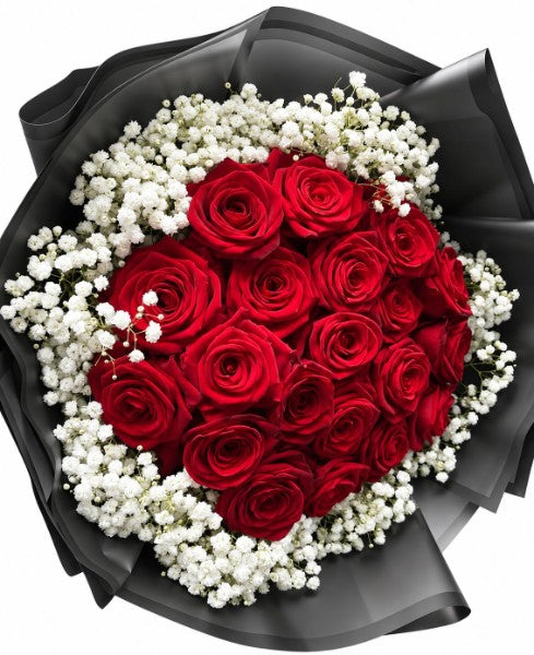 Red rose bouquet with baby's breath in black wrapping, viewed from above