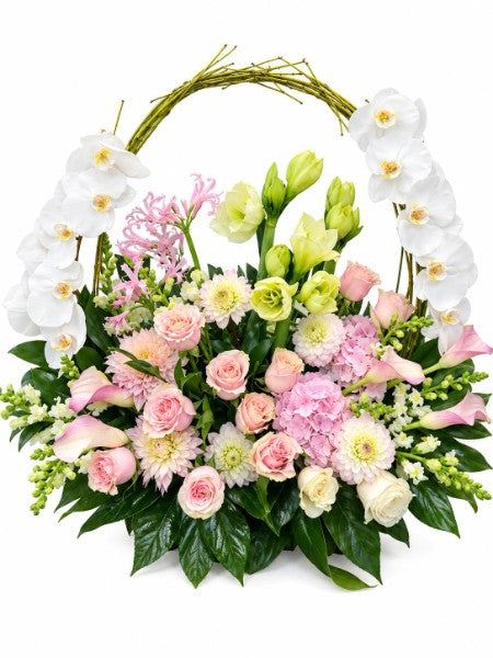 Elegant floral basket arrangement with pink roses, white orchids, hydrangeas and mixed blooms