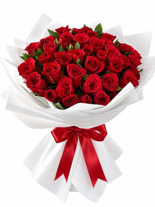 Classic red rose bouquet wrapped in white paper with red ribbon